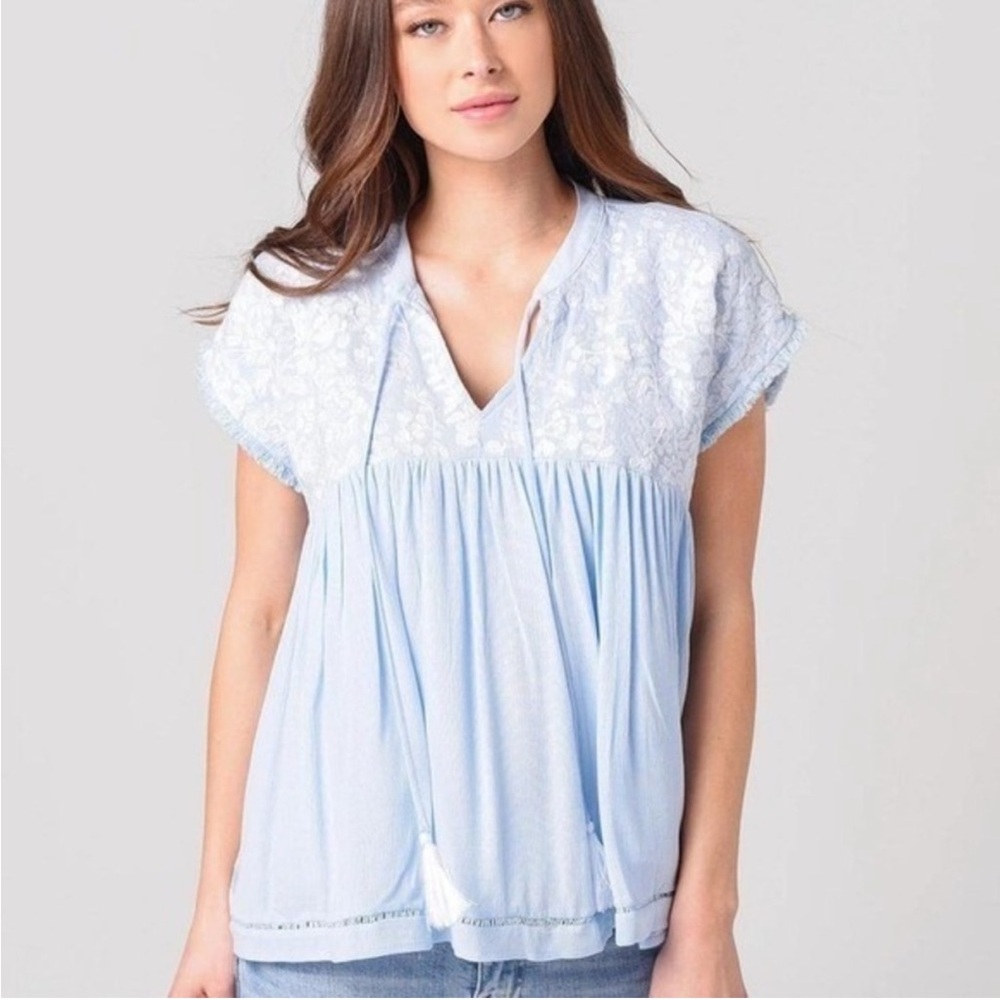 J. Marie top